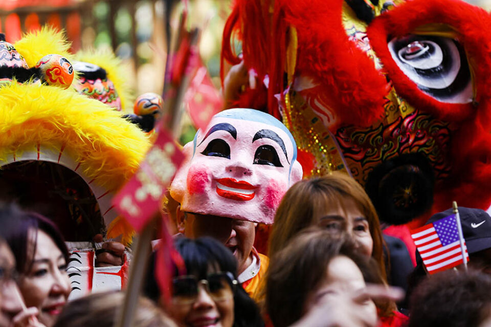 Traditional Chinese mask in the crowd at Montreal street parade