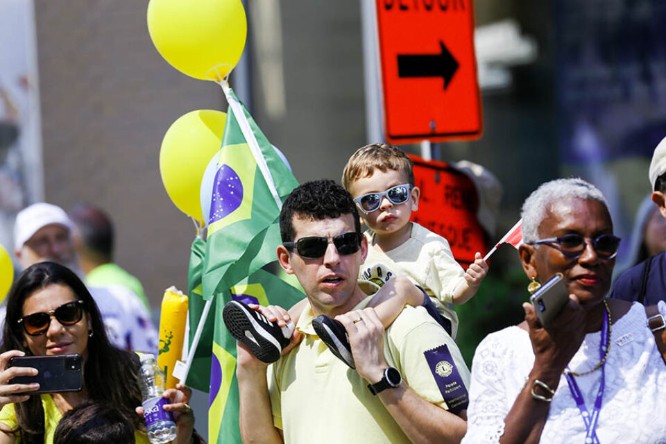 Young boy on father's shoulders at Montreal event street parade