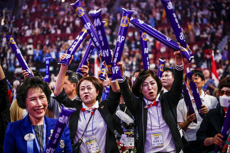South Korean convention delegates cheering, Montreal event photography