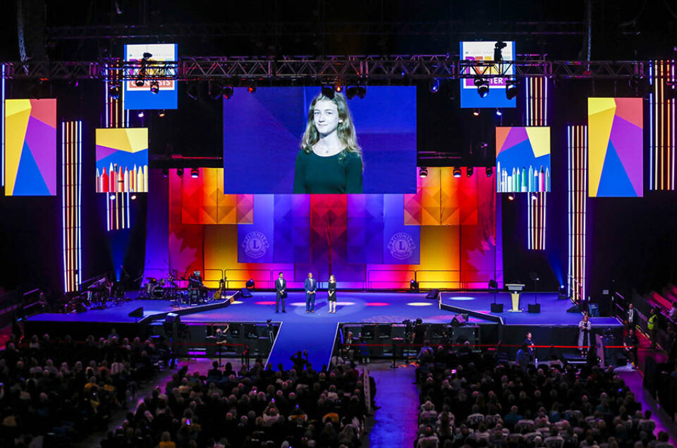 Art competition winner onstage, LCIC 2022 Montreal