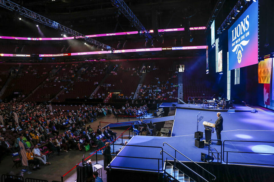 Convention presenter onstage, Bell Centre, Montreal