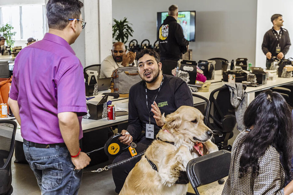 Delegates and dog at Montreal tech event