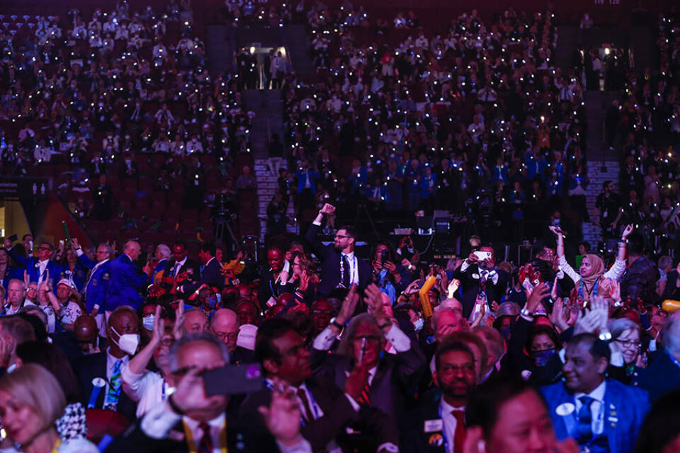 Convention delegates wave illuminated wrsitbands