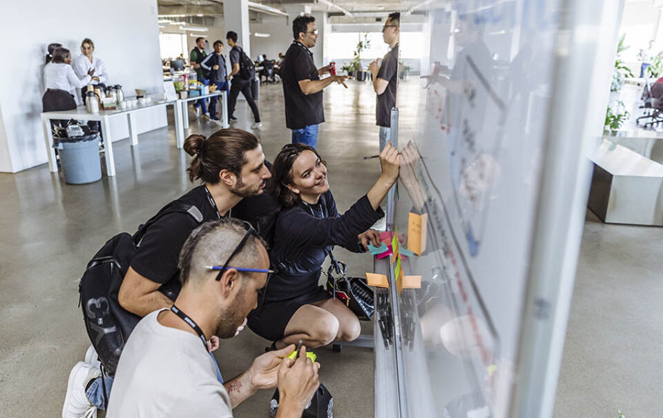 Delegates using whiteboard at Montreal tech event