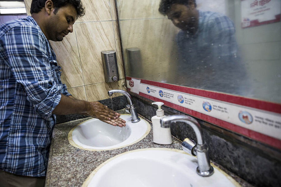 Man washing hands at sink