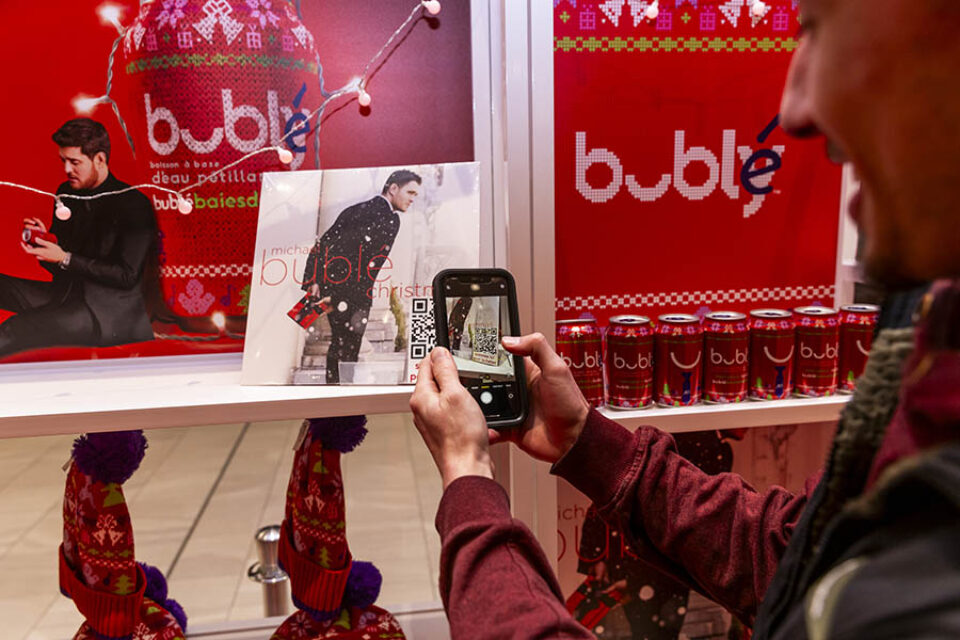 Man scanning QR code at Montreal corporate event
