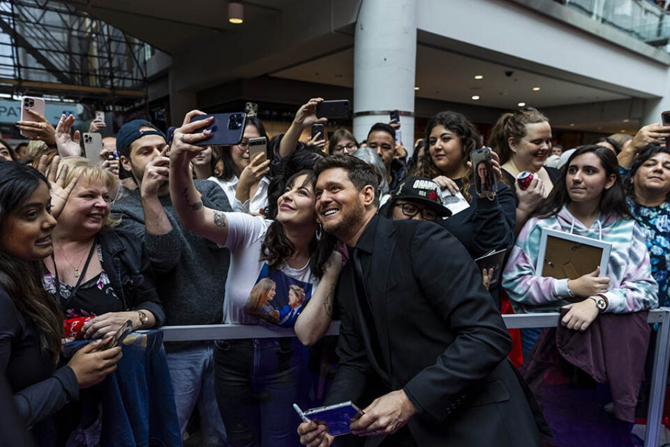 Michael Bublé taking selfie with fan
