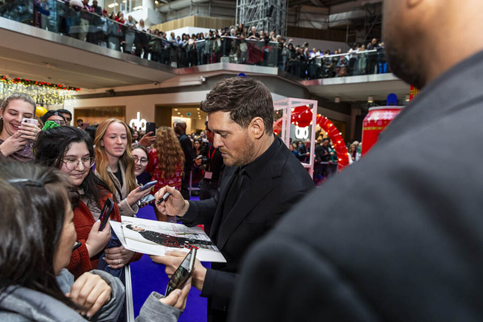 Michael Bublé signing an album during his Toronto event