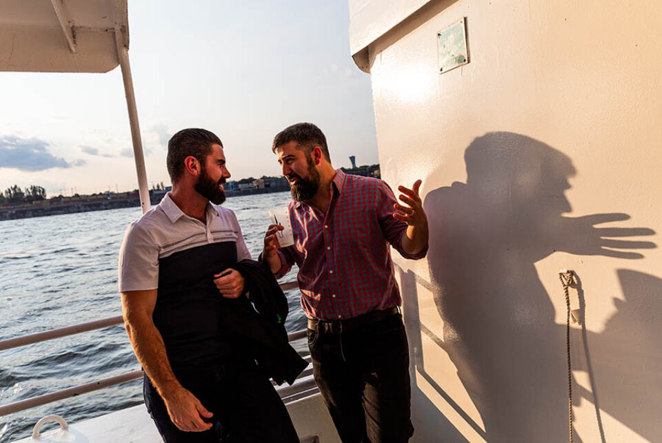 People talking at event on boat in Montreal