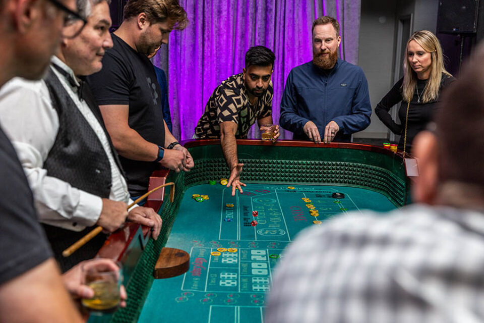 Montreal corporate event photographer - delegates play craps