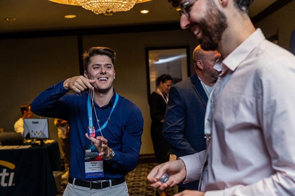 Men playing with yoyos at a corporate event in Montreal