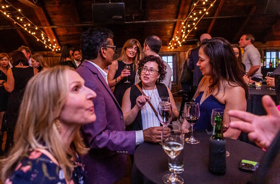Party guests talking at a Montreal event