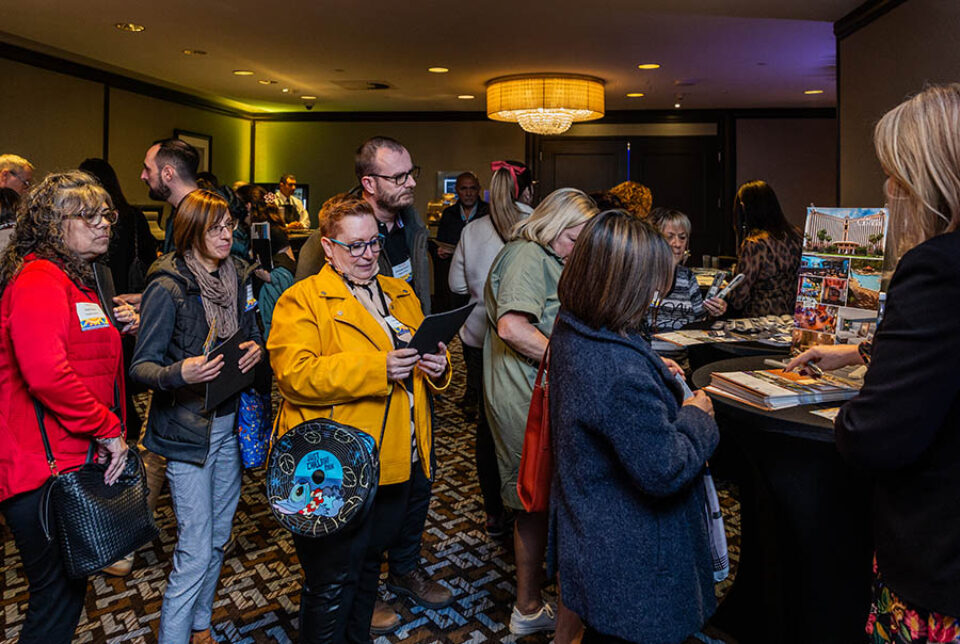 Montreal event delegates queue for travel brochures and information