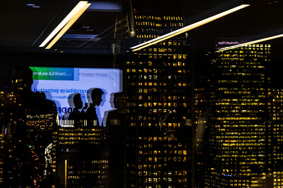 Networking event guests reflection, downtown Montreal