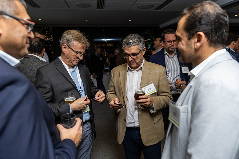 Montreal networking event photographer of event guests sharing business cards