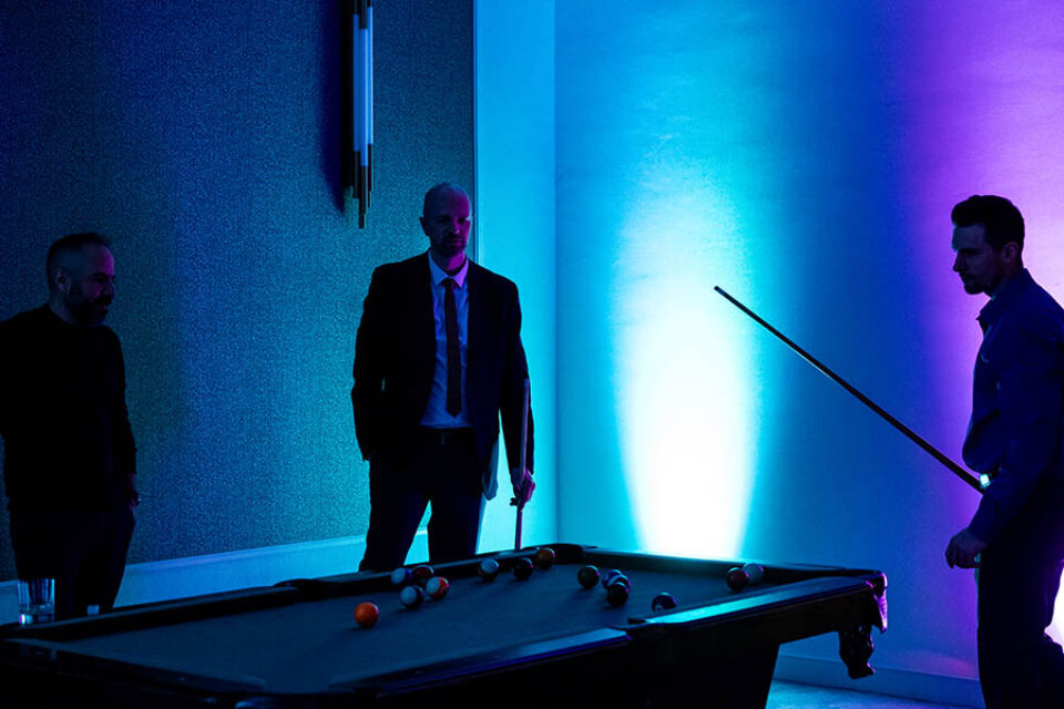 Montreal conference guests play pool in the evening