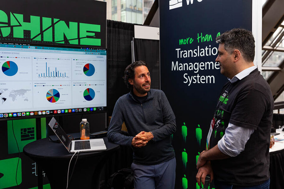 Trade fair vendor chatting, Montreal conference photography