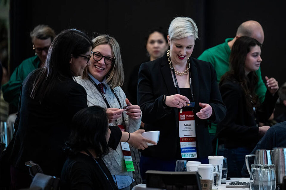 Exchanging business cards, by conference photographer Montreal
