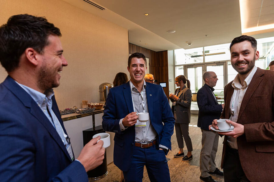 Event delegates enjoy a coffee break, by Montreal business event photographer