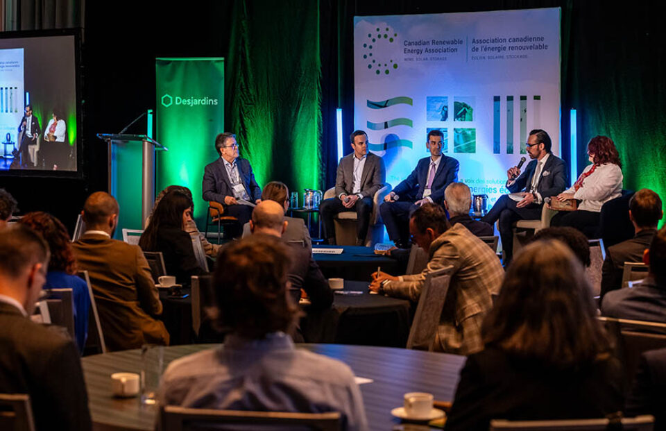 Audience watches panel discussion, by Montreal business event photographer