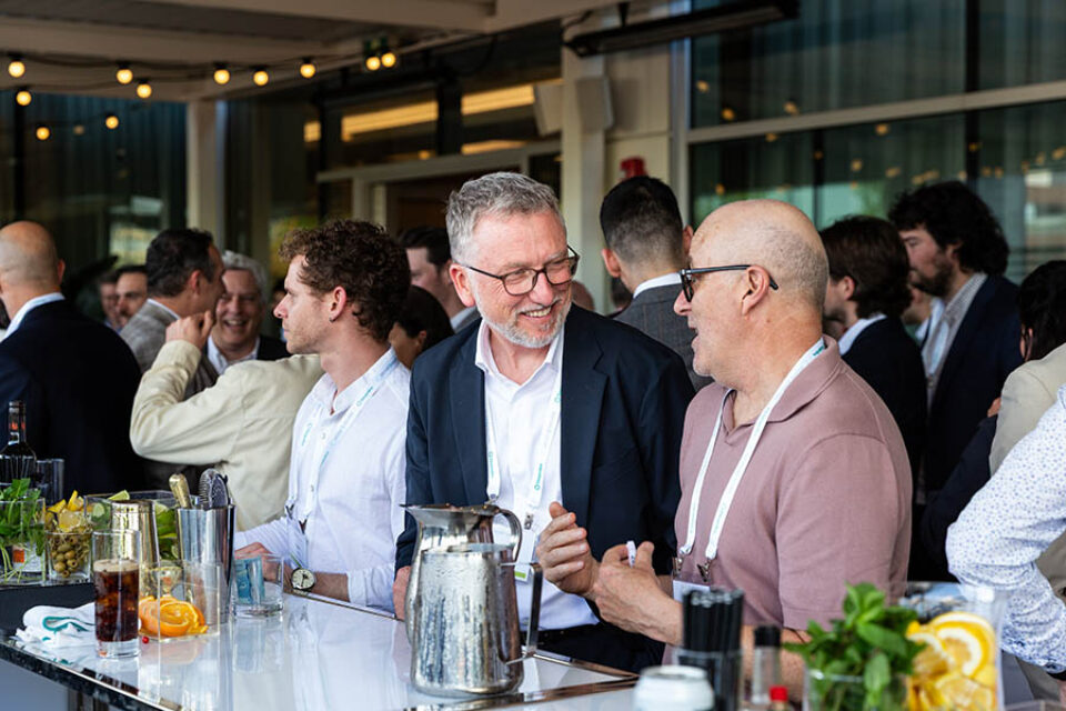 Event guests chatting at the bar, by Montreal business event photographer