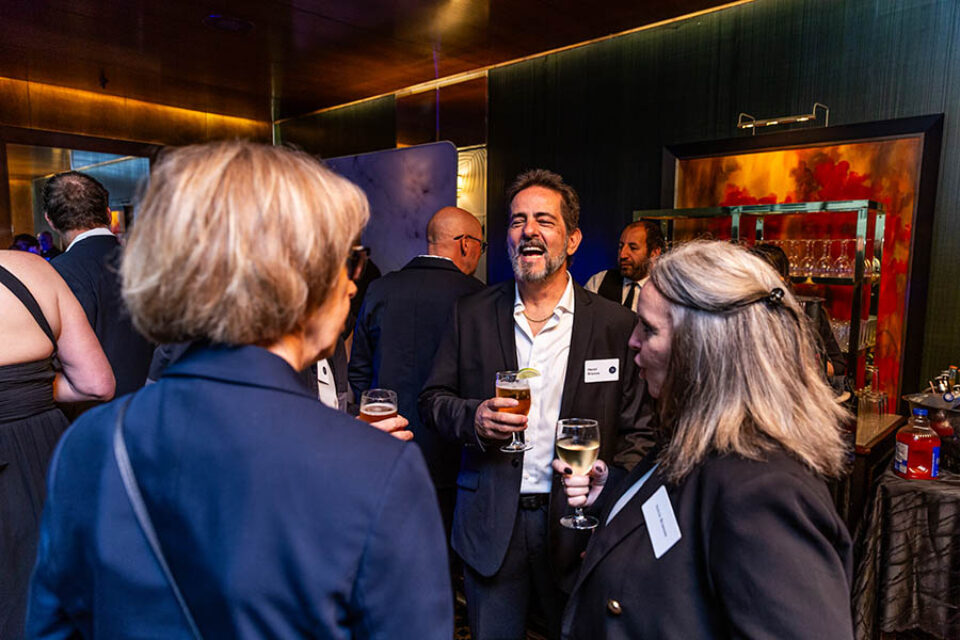 Montreal business celebration photography, event guests having a drink