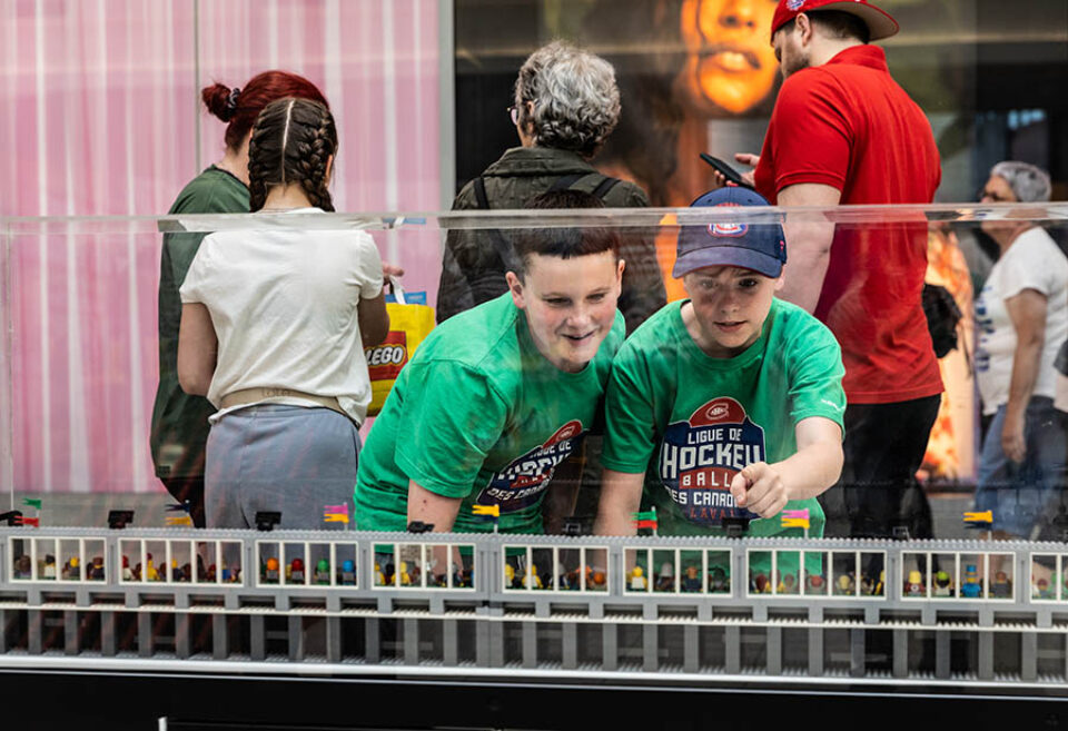 Boys looking into F1 LEGO display case, Montreal F1 event photography
