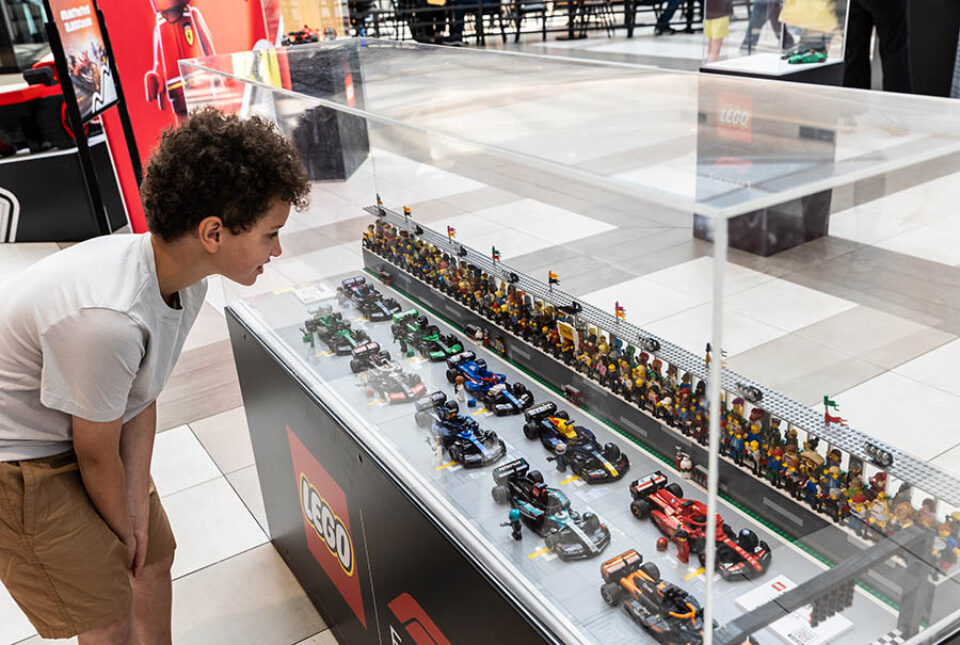Boy looks at LEGO F1 racetrack, Montreal Formula One event photography
