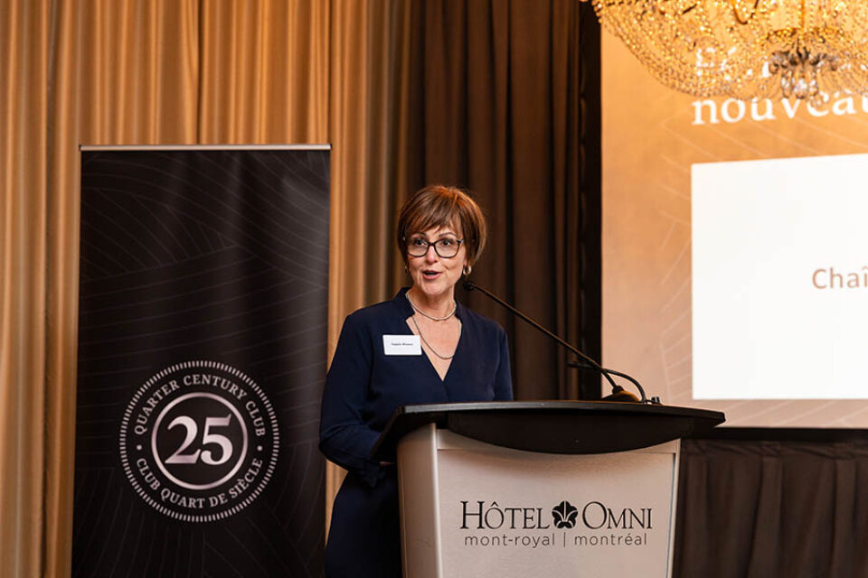 Event presenter onstage during Montreal business celebration event