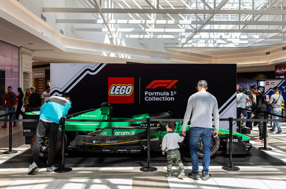 Visitors looking at lifesized LEGO Aston Martin F1 racing car in Montreal - Canadian GP event photographer