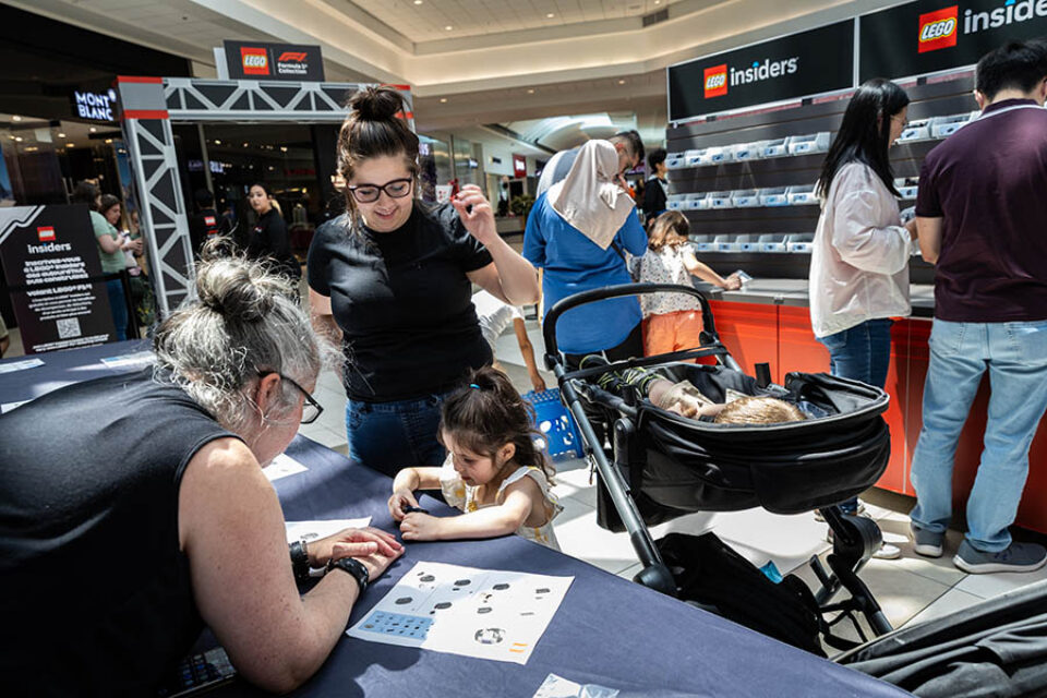 Montreal Formula One event photographer shot of a family building F1 LEGO