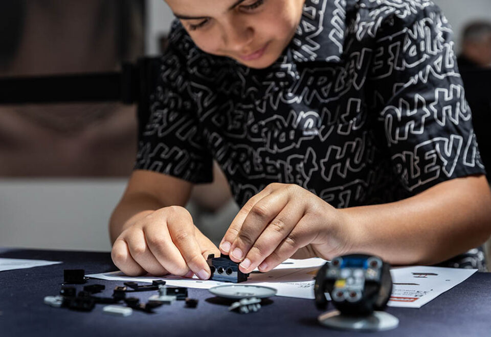 Boy builds LEGO F1 steering wheel at a Montreal F1 event