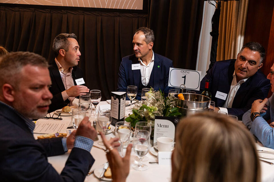 Montreal business celebration photographer - guests chat