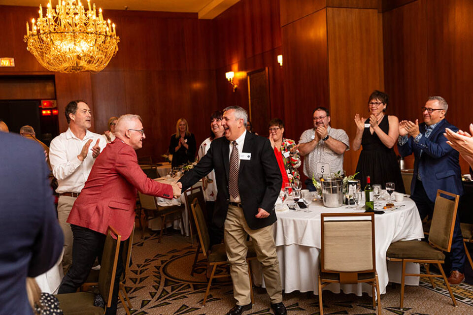Montreal business celebration event guests congratulate an award winner