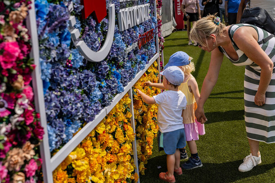 Children interact with LEGO botanicals wall in Montreal