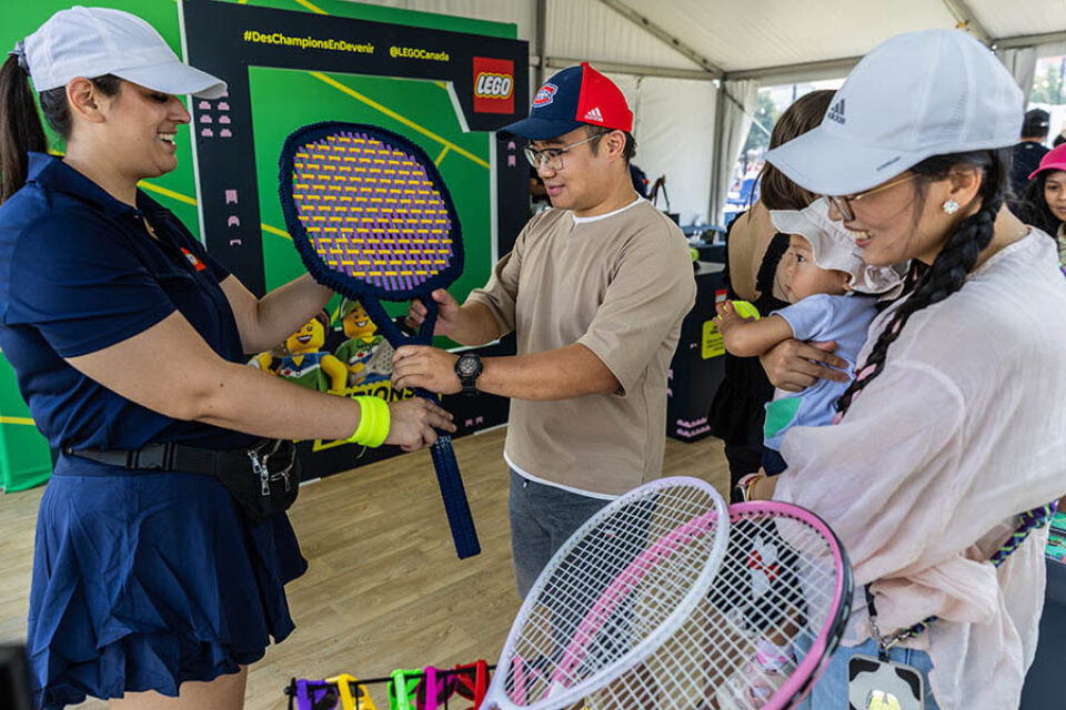 Montreal tennis event photographer - family prepares for photobooth