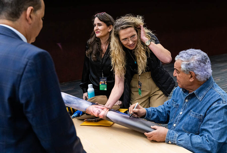 Dr Zahi Hawass signs an autograph for a fan at his Montreal event