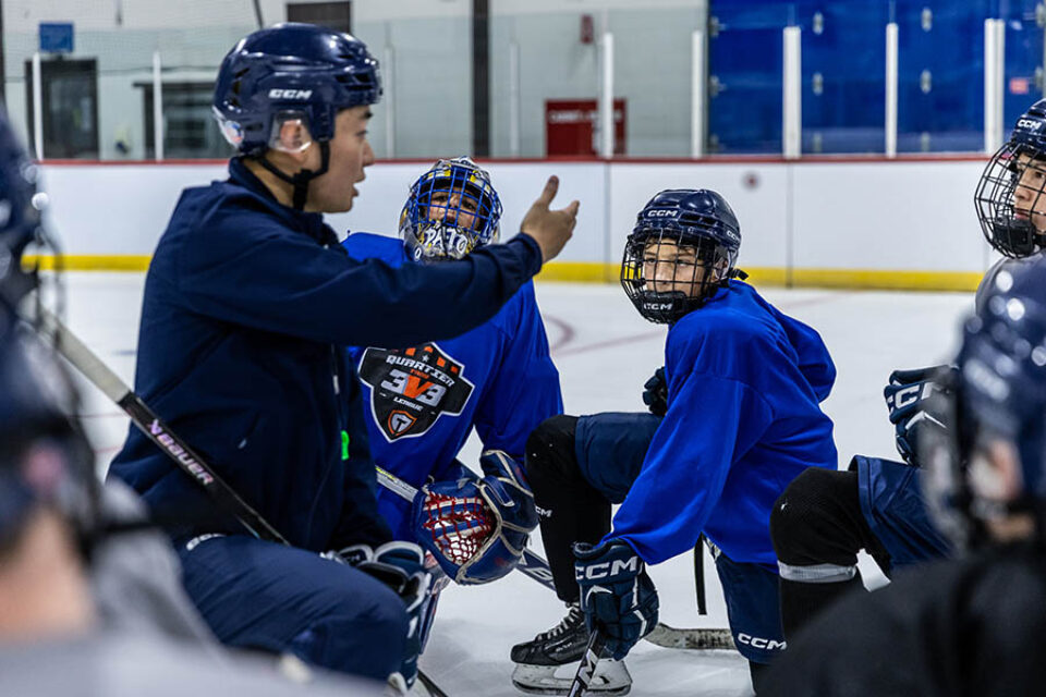 A hockey team receives coaching, Montreal college sports photography
