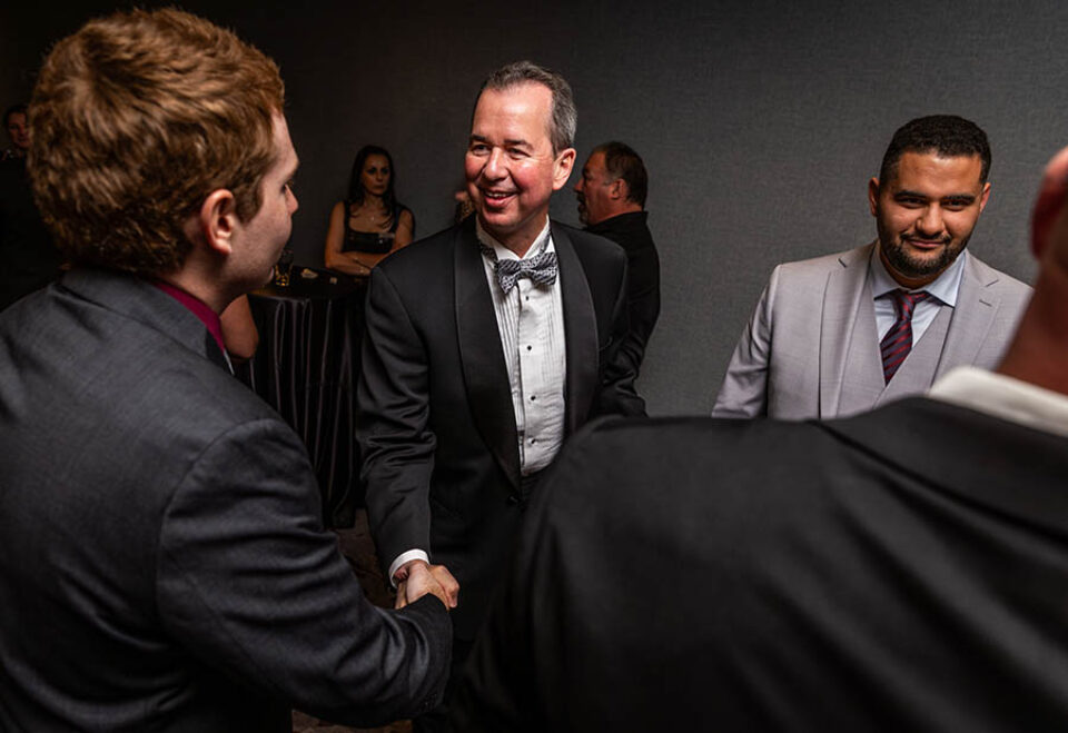 Business Xmas dinner guests greet each other at Ottawa event