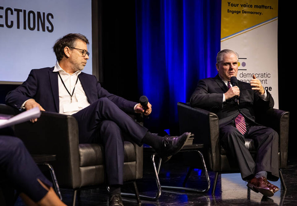 A man on an event panel, summit photography Montreal