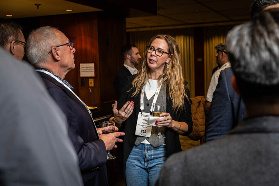 Guests chat at networking reception during a conference in Montreal