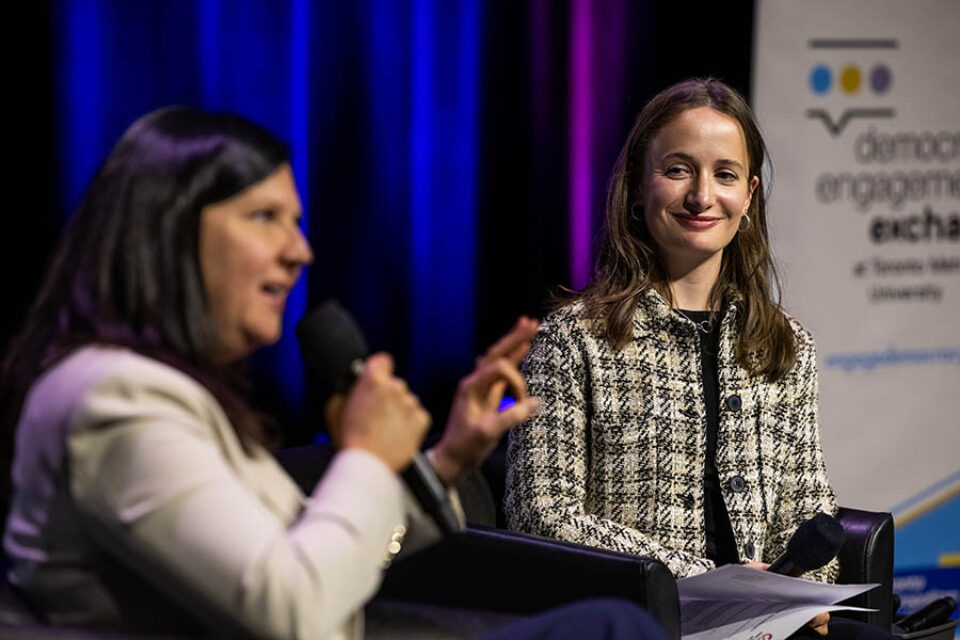 Woman smiles at Montreal summit speaker