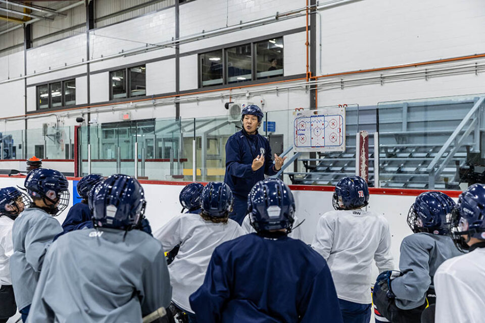 Hockey team on-ice coaching photographed by a professional Montreal photographer for corporate communications materials