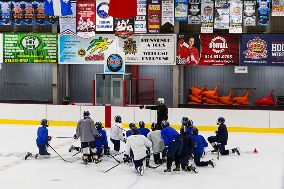 Hockey team huddle for coaching, Montreal college sports photography