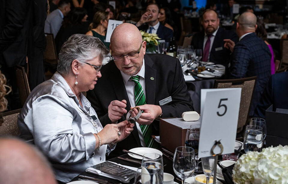 Ottawa event guests admire watch given as a gift