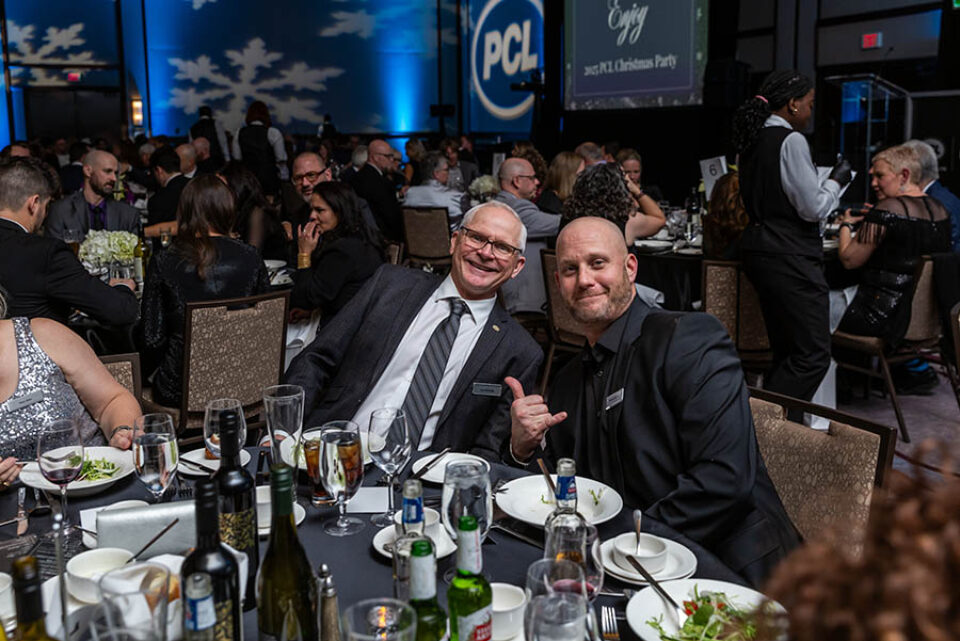 Posing for a photo at a business Christmas party, Ottawa event photographer