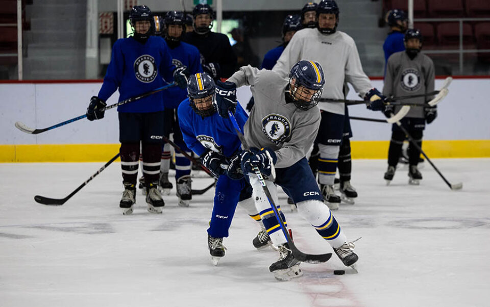 Montreal college sports - Hockey players puck drill