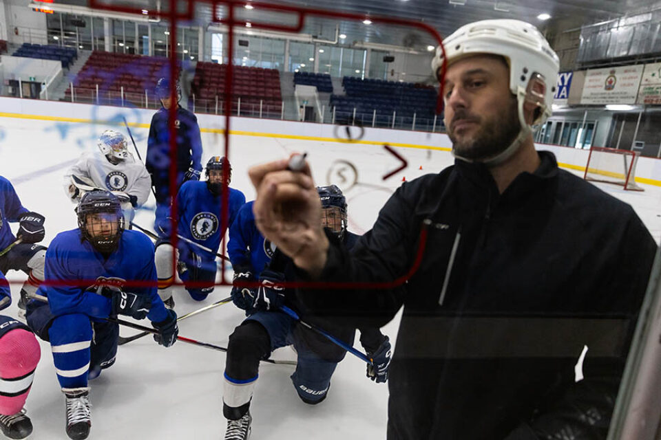 Image of coaching during hockey practice by Montreal college sports photographer