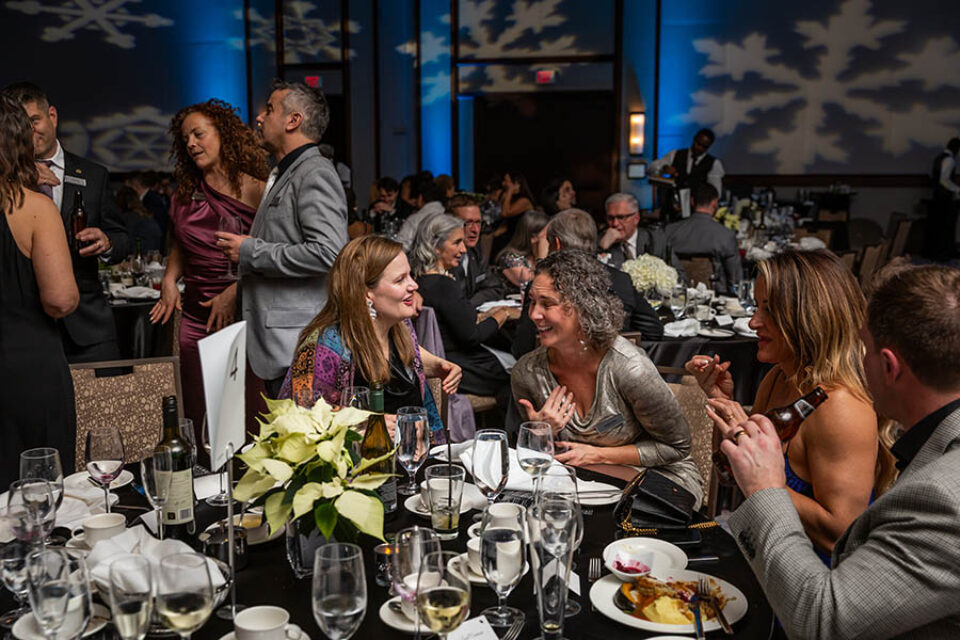 Sharing a joke at a corporate Xmas dinner, Ottawa event photography