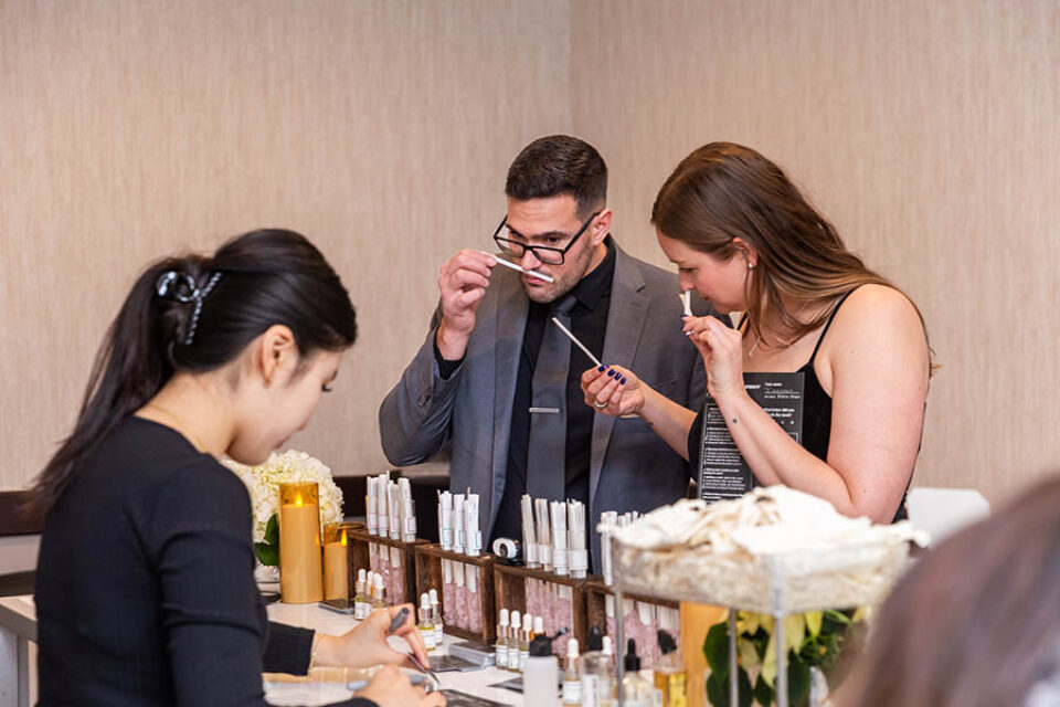 Ottawa event photography, guests sampling scents at perfume counter